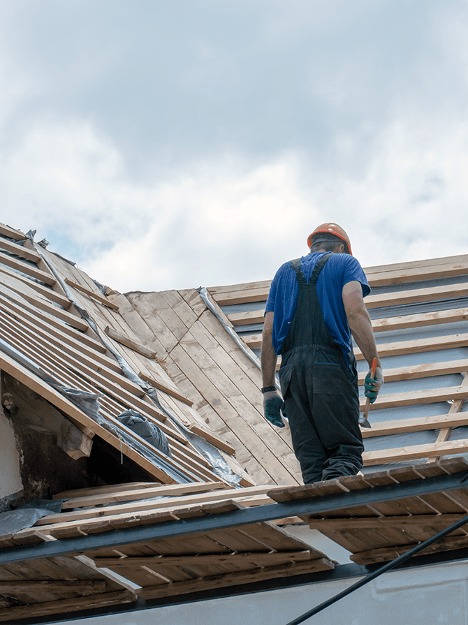 670 x 895 px repair-old-wooden-roof-replacement-tiles-wooden-beams-old-house-carpenter-with-tools-his-hands-is-roof-building-work-min